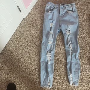 Distressed light color skinny jeans